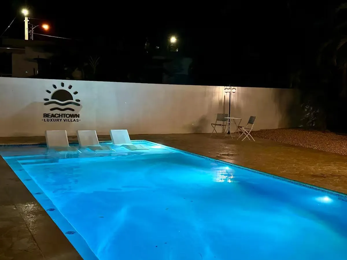 Beachtown Luxury Villas Apt 101 contacts